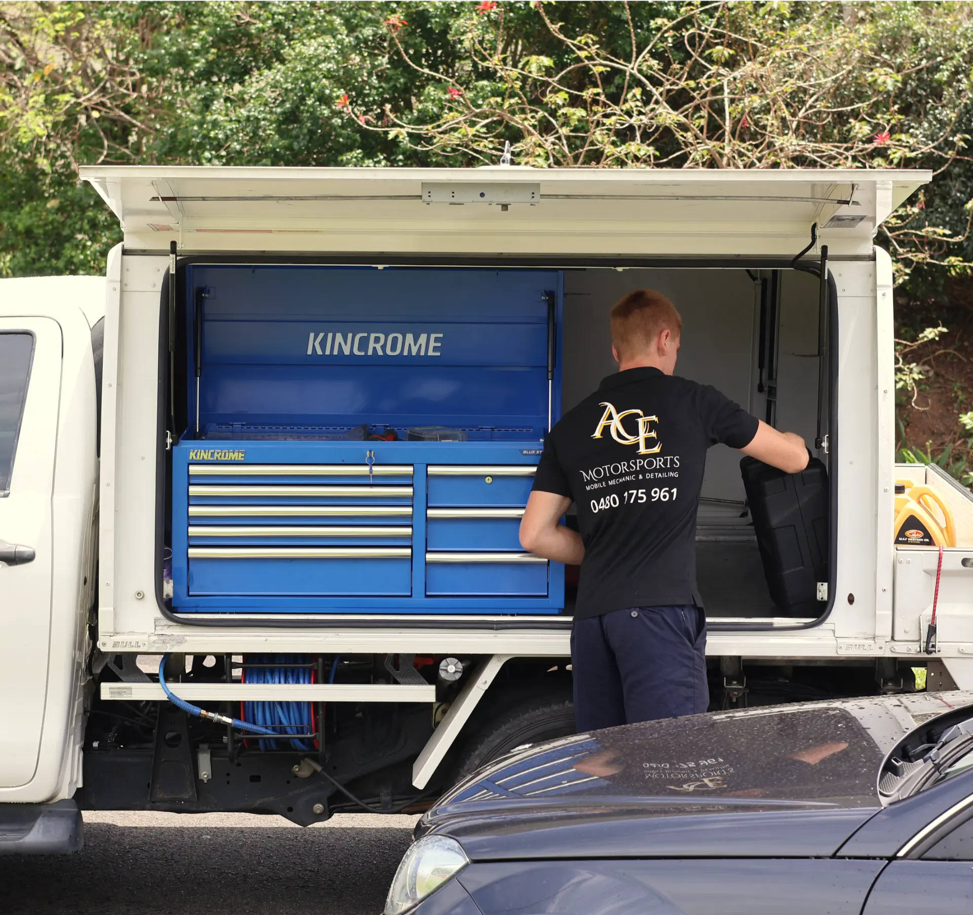Ace Motorsports technician working out of the mobile workshop ute